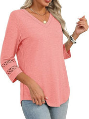 Pink 3/4 sleeve t-shirt with V-neck and cutout detail on sleeves.
