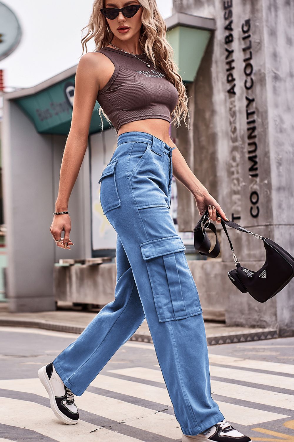 Utility pocket wide leg cargo pants in dusty blue with multiple flap pockets.