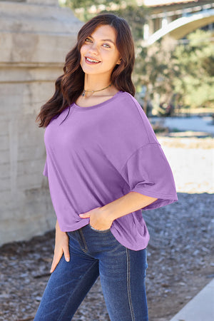 Lavender boxy dolman crop t-shirt with relaxed fit and short sleeves.