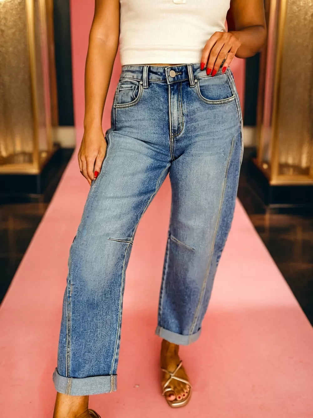 Vintage-inspired high-waisted seam jeans in light wash denim with cuffed hems.
