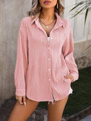 Blush pink textured pleated button-down shirt with a relaxed fit.