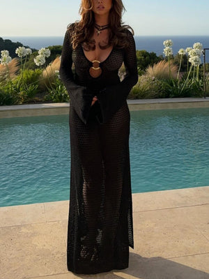 Black knit maxi dress with keyhole neckline, gold ring detail, and bell sleeves.