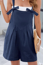 Dark Navy linen romper with bow straps and pleated front detail.