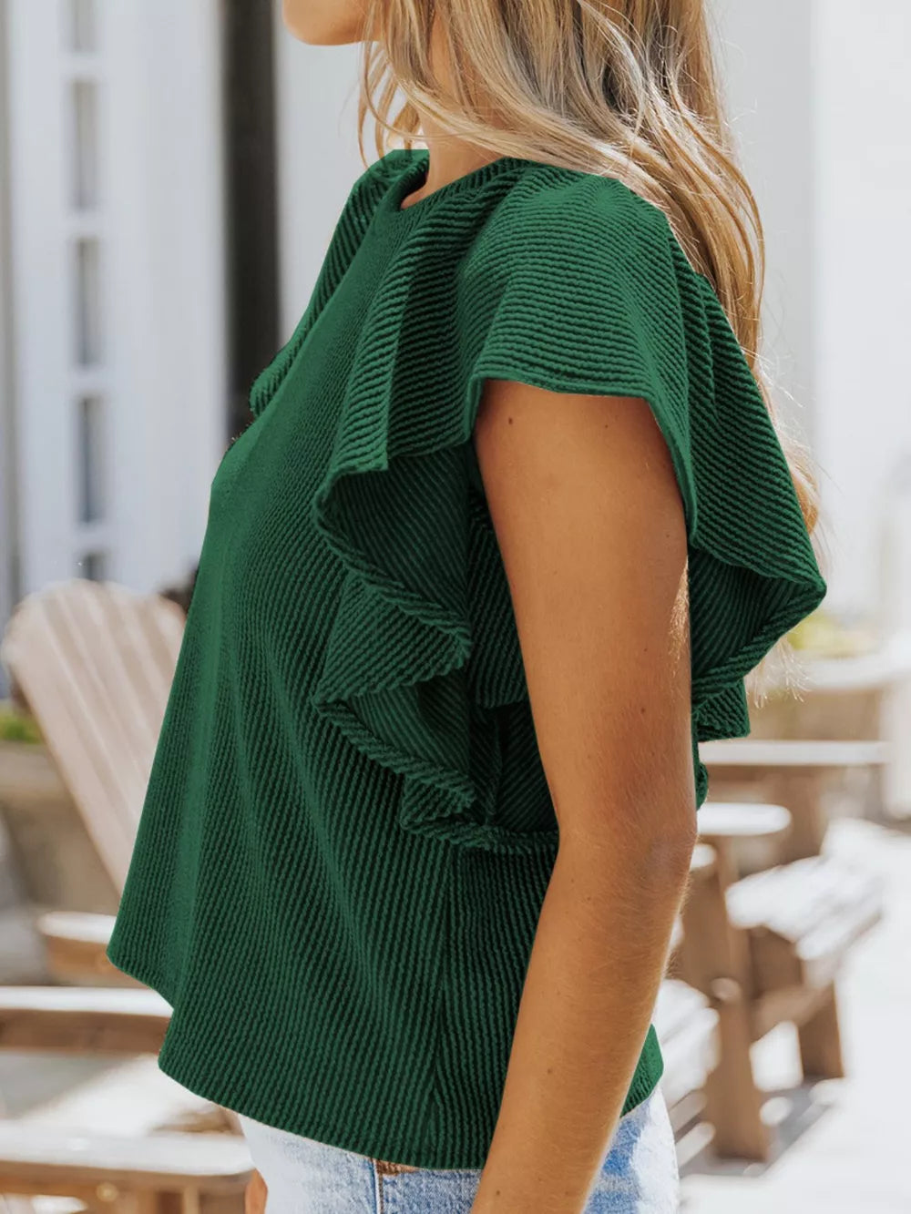 Dark green ribbed t-shirt with ruffled short sleeves and crew neck.