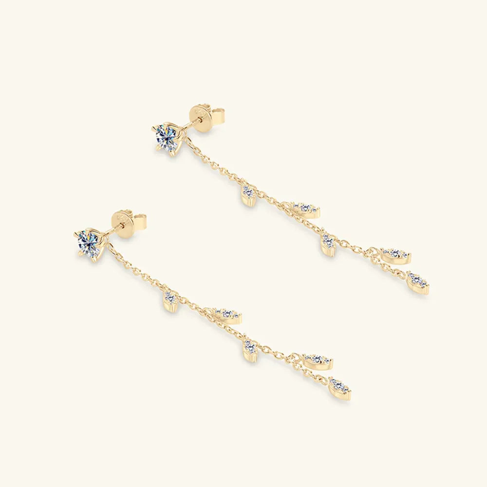 Gold dangling crystal vine earrings with delicate chain and sparkling accents.