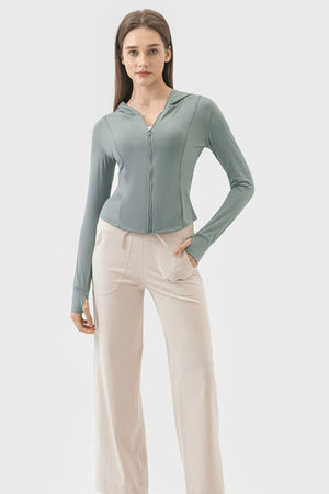 Teal active zip-up hoodie with thumbholes and a hood, worn by a model.