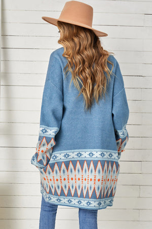 Blue knit open-front cardigan with geometric trim on sleeves and hem.