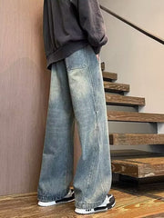 Men's blue wide leg jeans with drawstring waist and distressed wash.