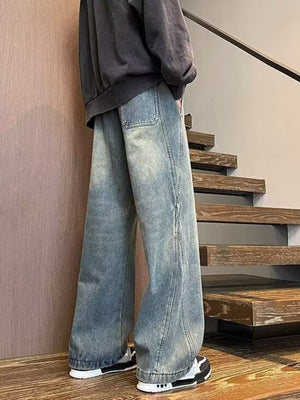 Men's blue wide leg jeans with drawstring waist and distressed wash.