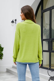 Textured turtleneck sweater in lime green with long sleeves.
