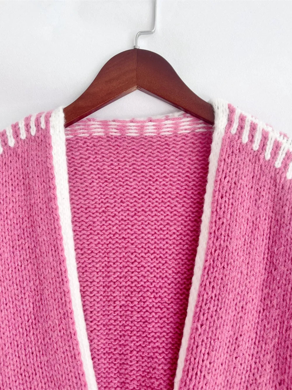 Hot Pink oversized cardigan with white contrast trim and stitching detail.