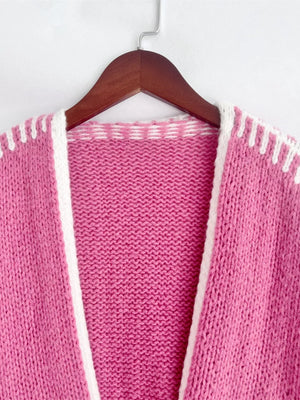 Hot Pink oversized cardigan with white contrast trim and stitching detail.