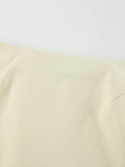 Chic cotton midi skirt in beige with a subtle slit detail.