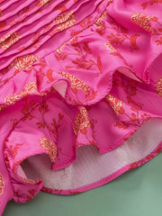 Pink floral print blouse with ruffled hem and pleated detail