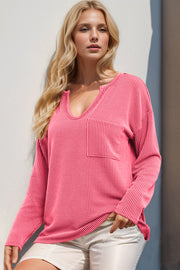 Pink ribbed plunge neck top with chest pocket, cotton blend.