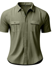 Military green short sleeve button-down shirt with two chest pockets and subtle texture.