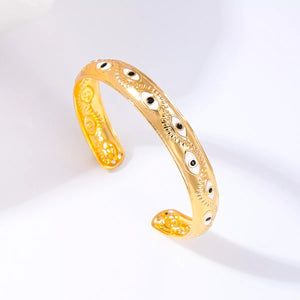 Golden 18K gold-plated bangle bracelet with evil eye pattern