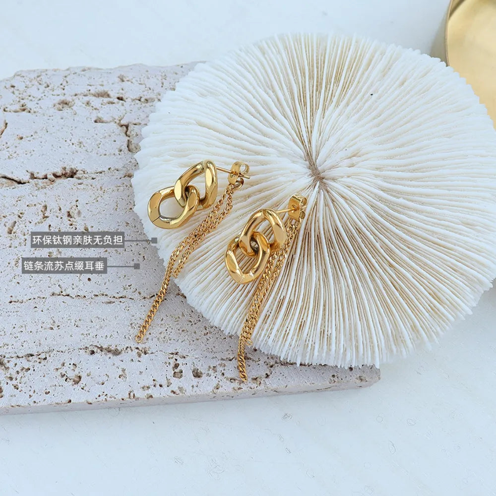 Gold linked chain drop earrings with delicate chain fringe detail