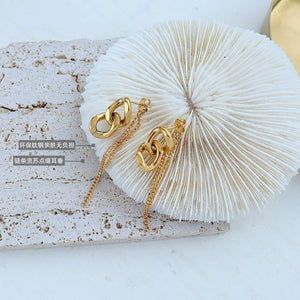 Gold linked chain drop earrings with delicate chain fringe detail