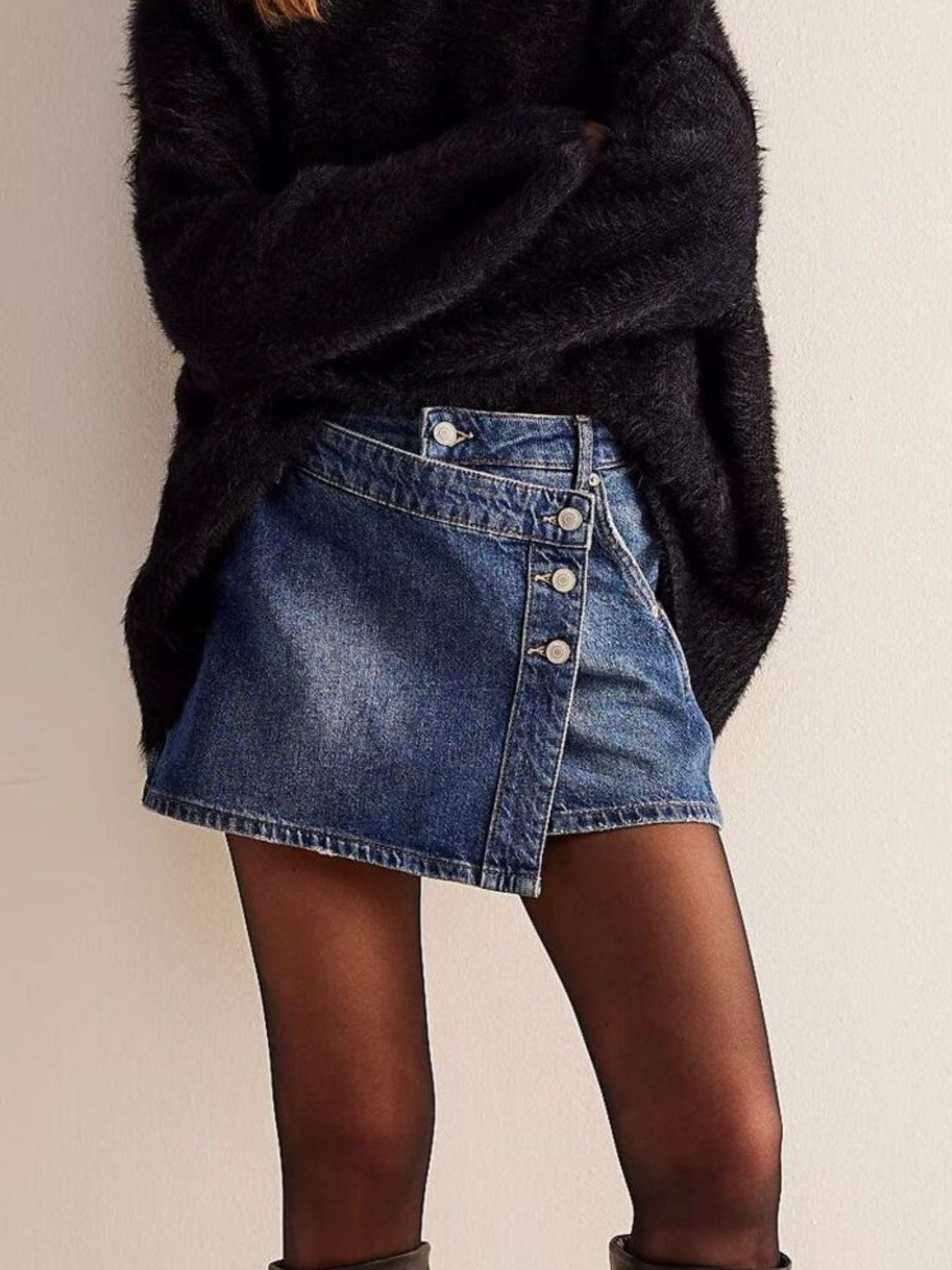 Blue denim skort with asymmetrical button-front detail and raw hem
