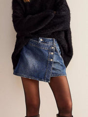 Blue denim skort with asymmetrical button-front detail and raw hem