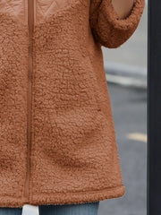 Caramel teddy fleece hoodie with quilted panel detail and zipper closure.