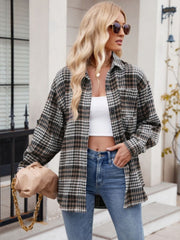 Oversized plaid shirt jacket in brown, black, and white with a chest pocket.
