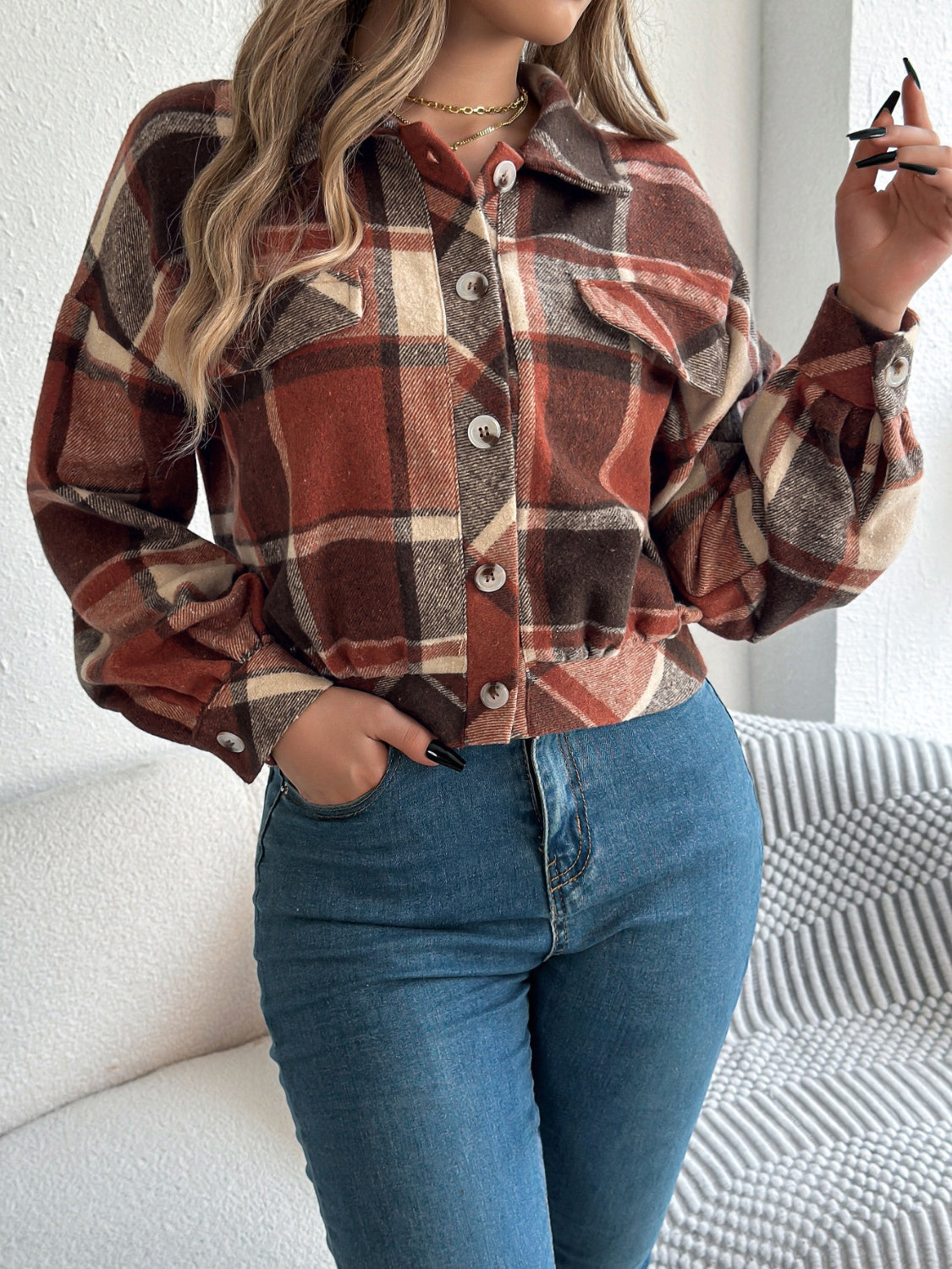 Cropped plaid shacket in terracotta with gathered sleeves and button front.