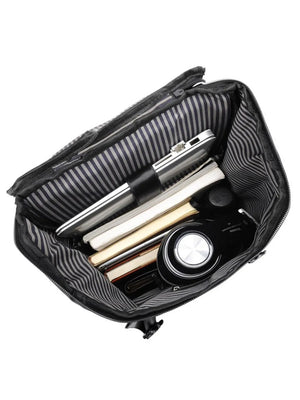 Tech-utility backpack interior with books, laptop, and headphones.