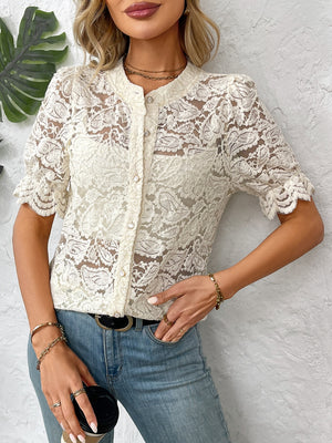 Cream floral lace blouse with mandarin collar, short puff sleeves, and button front.