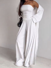 White ruched strapless top and wide-leg pants with a long open cardigan.