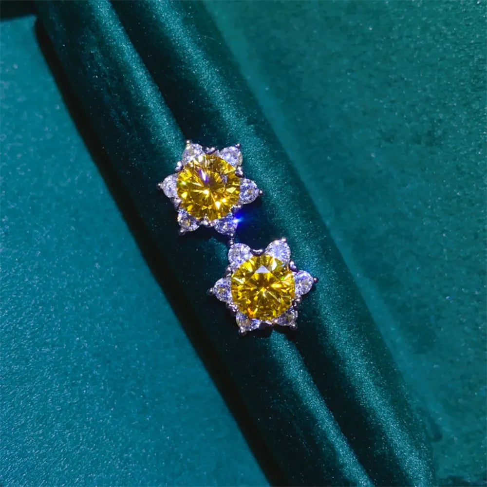 Golden sunburst moissanite stud earrings in 925 sterling silver with yellow center stones.