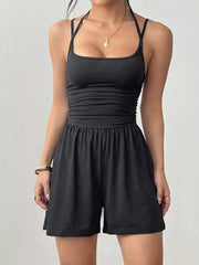 Black ruched spaghetti strap romper with square neckline and drawstring waist.
