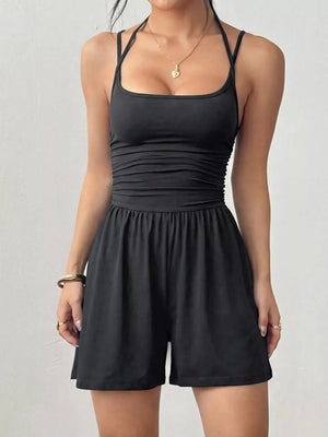 Black ruched spaghetti strap romper with square neckline and drawstring waist.