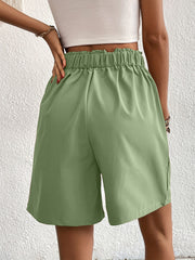 Pleated front bermuda shorts in light green with elastic waist