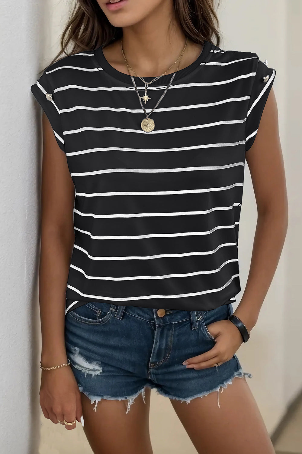 Button-shoulder black and white stripe tee with cap sleeves.