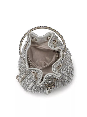 Silver rhinestone embellished mini bucket crossbody bag with chain handle and strap.