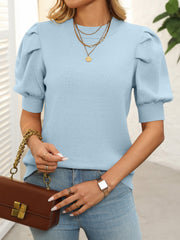 Light blue knit sweater with mock neck and puff sleeves