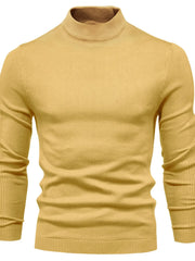 Gold ribbed mock neck sweater with sculpted shoulder detail and long sleeves.