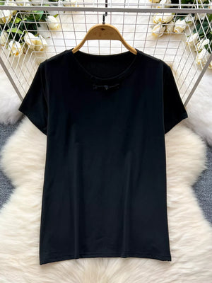 Black cotton t-shirt with short sleeves and a knotted detail at the neckline.
