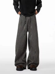 Striped wide-leg sweatpants in black and gray with drawstring waist.