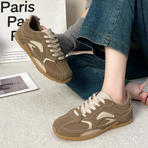 Camel retro runner sneakers with contrasting panels and lace-up closure.