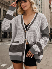 Waffle knit colorblock cardigan with V-neck, buttons, and pockets in gray and white acrylic.