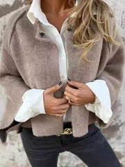 Cozy fuzzy knit cardigan in light gray with button detail, styled over a white shirt.