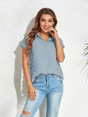 Light blue textured dot poplin shirt with short sleeves and a collared neckline.