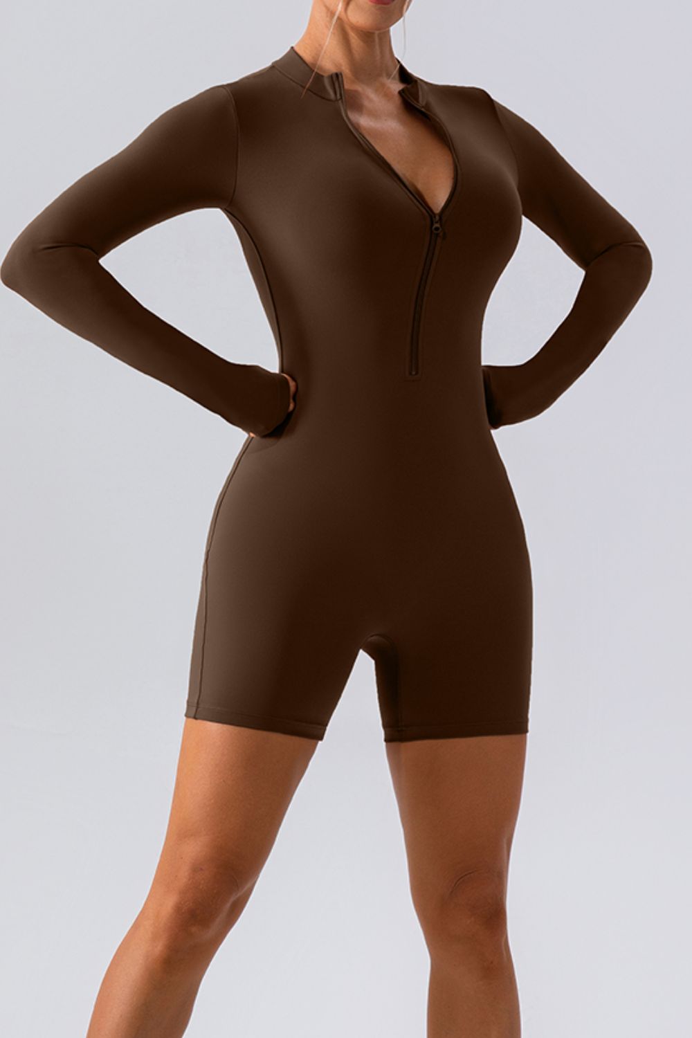Chocolate sculpted performance romper with zip detail and thumbholes
