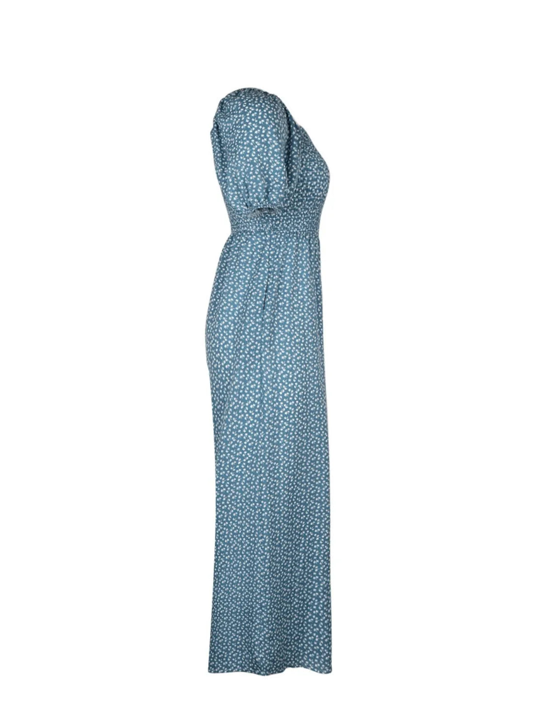 Dusty blue floral wide-leg jumpsuit with smocked bodice and puff sleeves.