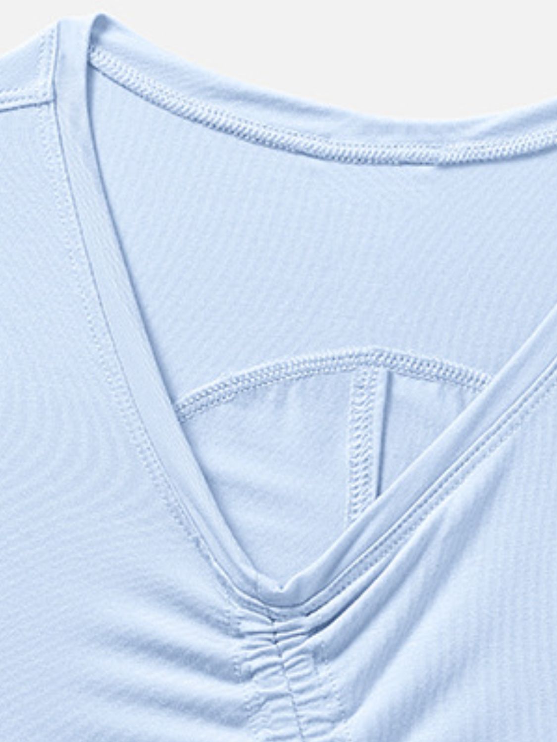 Light blue asymmetric ruched crop tank top with V-neck detail