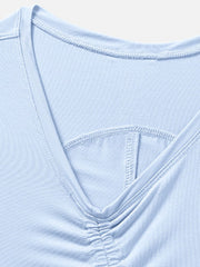 Light blue asymmetric ruched crop tank top with V-neck detail