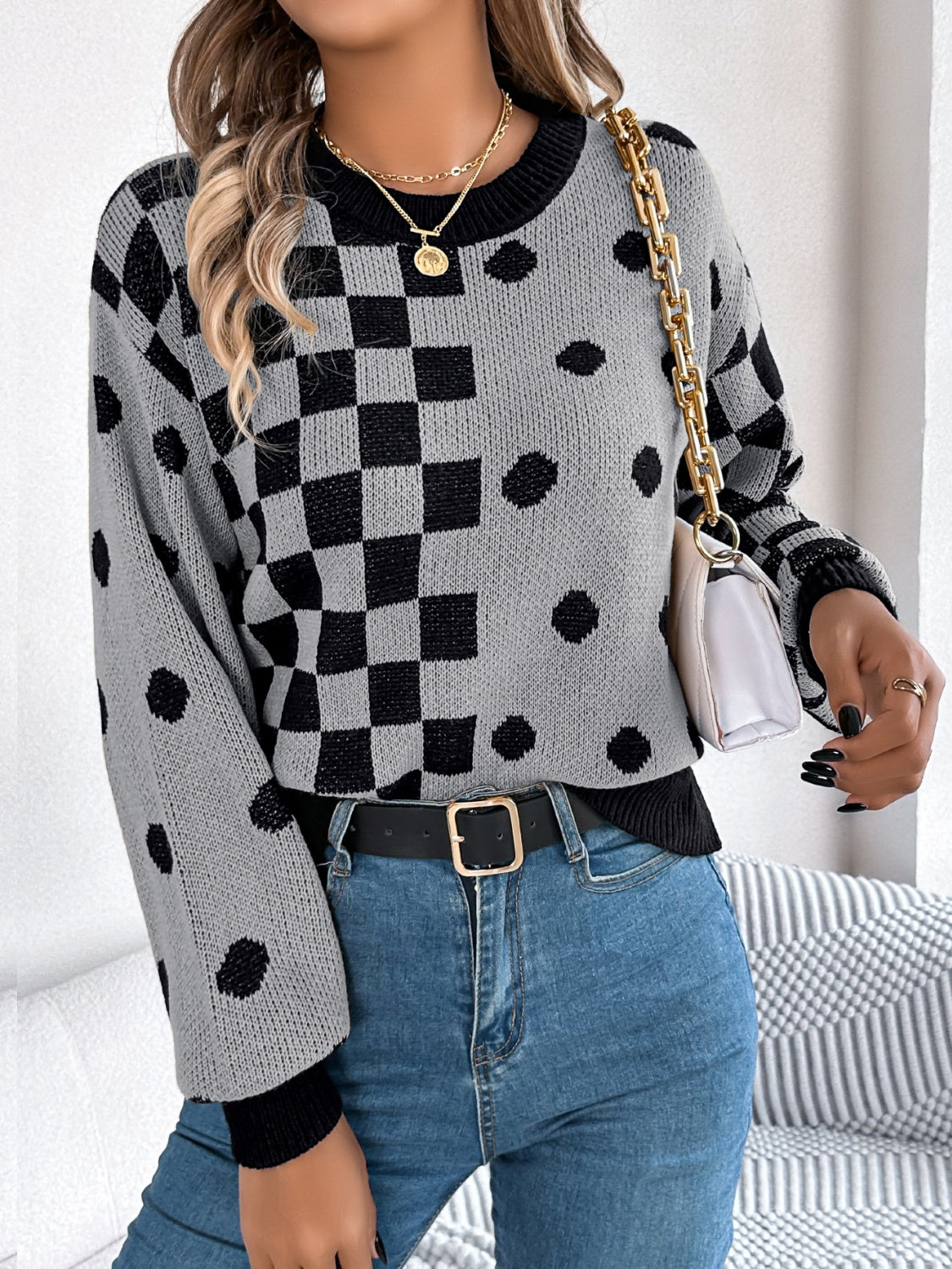 Gray knit sweater with checkerboard and dot intarsia pattern, crew neck, long sleeves.
